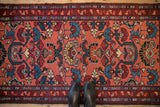 Hand-knotted Mehreban runner featuring double niche cloud bands and large floral blossoms.