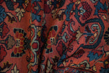 Vintage Mehreban rug's hand-knotted pile, revealing blush, blue, and wine red floral patterns.