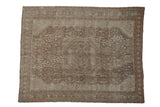 Distressed vintage Shiraz carpet featuring central medallion, geometric patterns, muted tones, 6'9