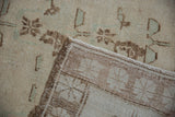 The hand-knotted reverse and intact side cord selvage of a vintage Turkish Oushak carpet.