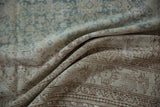 Distressed vintage Malayer rug, showing heavy abrashes and changing pale coffee brown tones.