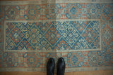 Distressed Mahal rug's lattice pattern with inverted floral views, sky blue, tangerine, ivory.