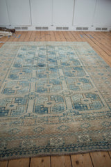 Distressed pile of Ersari rug showing geometric guls, plant motifs, and layered borders.