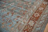 Distressed Bibikabad carpet showcasing delicate vinery, palmettes, and dusty terracotta border.