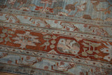 Distressed vintage Bibikabad rug showcasing delicate vinery and time-softened blue, terracotta tones.