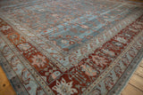 Distressed Bibikabad carpet corner, soft blue field with vinery, abrashes, and terracotta border.