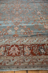 Distressed vintage Bibikabad carpet showing dusty blue field, wine red border, vinery, and abrash.
