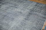 Hand-knotted vintage distressed Sparta rug texture, showing worn pile in pale blue and ivory.