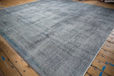 Distressed vintage Sparta carpet texture with wear to foundation, showing oxidized silver tones.
