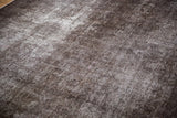 Vintage Sparta carpet pile, distressed charcoal brown and oxidized silver with visible foundation.