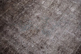 Distressed texture and visible foundation of a Vintage Overdyed Sparta carpet.