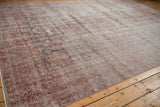 Distressed Turkish Sparta carpet, faded floral pattern, pale raspberry and ivory.