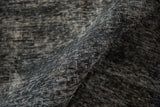Close-up of distressed pile on vintage Turkish Sparta carpet in dusty teal and charcoal tones.