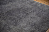 Distressed charcoal and dark navy pile texture of the vintage overdyed Sparta carpet.