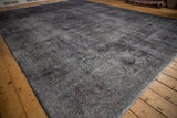 Distressed aesthetic and worn knot heads of the charcoal overdyed Sparta rug.