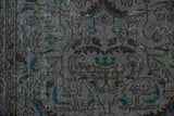 Distressed Sparta rug texture, slate blue and brown patterns with bright turquoise floral accents.