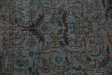 Distressed slate blue floral pattern with faint foundation showing on vintage Sparta rug.