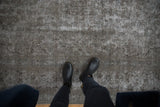Textured vintage Meshed carpet showing wear to foundation in oxidized silver, ivory, brown.