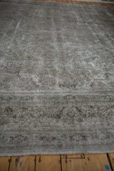 Worn pile revealing muted ivory, slate, and chocolate patterns on Meshed rug.