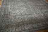 Vintage Meshed carpet showing wear to foundation and muted silver, ivory, brown tones.