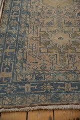 Low pile showing knot heads on the dusty blue geometric border of a vintage Karaja runner.