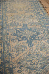 Evenly worn knot heads of a distressed Karaja rug in dusty blue and antique ivory.