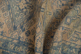 Low, even pile of a distressed Karaja rug with dusty denim blue geometric motifs.