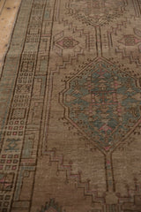 Close-up of distressed Serab runner, geometric motifs with soft wear, faded beige, blush, and seafoam tones.