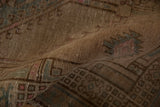 Distressed Serab runner pile showcasing worn texture, faint foundation, and muted geometric patterns.