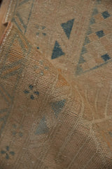 Close view of the hand-knotted texture showing even wear to the knot heads on a Persian runner.