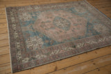 Distressed vintage Abadeh rug border, showing geometric patterns in pale aubergine and beige.