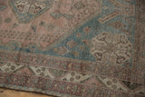 Distressed Abadeh rug border, showing geometric patterns in dusty blue and mauve.