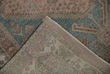 Folded Abadeh rug corner, highlighting distressed pile, intact side selvage, and fringe.