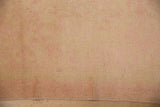 Hand-knotted texture of a vintage distressed Oushak runner in soft sand and dusty rose tones.