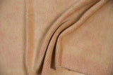 The reverse of a vintage Oushak rug, showing its hand-knotted wool foundation.