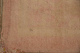Detail of the restored side cord and even hand-knotted pile in dusty rose and sand.