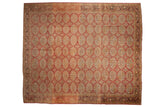 Vintage distressed Oushak carpet, elephant footprint medallions in dusty rose, gold, and dark brown border. 11'4