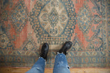 Distressed Veece rug detail, worn knot heads, abrashed ground, blush, blue, and cream.