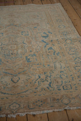 Distressed vintage Ahar rug: low pile, faint foundation, beige field, blue motifs, worn fringe.