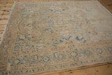Distressed vintage Ahar rug showing faded blue Samovar border and worn pile.