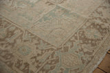 Distressed texture and seafoam green inverted Samovar turtle border on a vintage Heriz corner.
