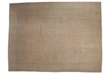 Distressed vintage Birjand carpet with muted sand and dusty blue Herati design.