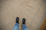 Distressed vintage Birjand carpet's soft, even wear; allover Herati design in sand and muted blue.
