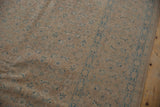 Soft, evenly worn distressed Birjand carpet displaying sand and dusty blue Herati motifs.
