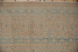 Even wear on distressed Birjand rug showing faded sand and powder blue Herati motifs.