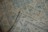 Faint foundation showing through on a vintage distressed Karaja rug with original selvage.