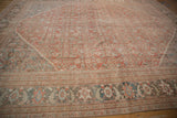Distressed Mahal carpet border showcasing palmette vines and pawn motif in soft tones.