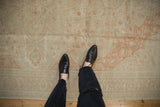 A detailed view of the distressed Kayseri carpet's low pile, revealing its texture and time-softened colors.