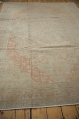 Angled view across the low, evenly worn pile of a vintage distressed Kayseri carpet.