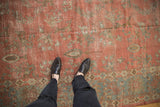 Vintage distressed Mahal carpet with dusty raspberry field, faded floral motifs, and powder blue border.